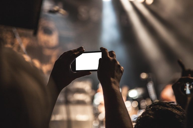 Smartphone, hands, screen — Canva Pro Group Buy Offering Access to Premium Design Tools Without High Fees
