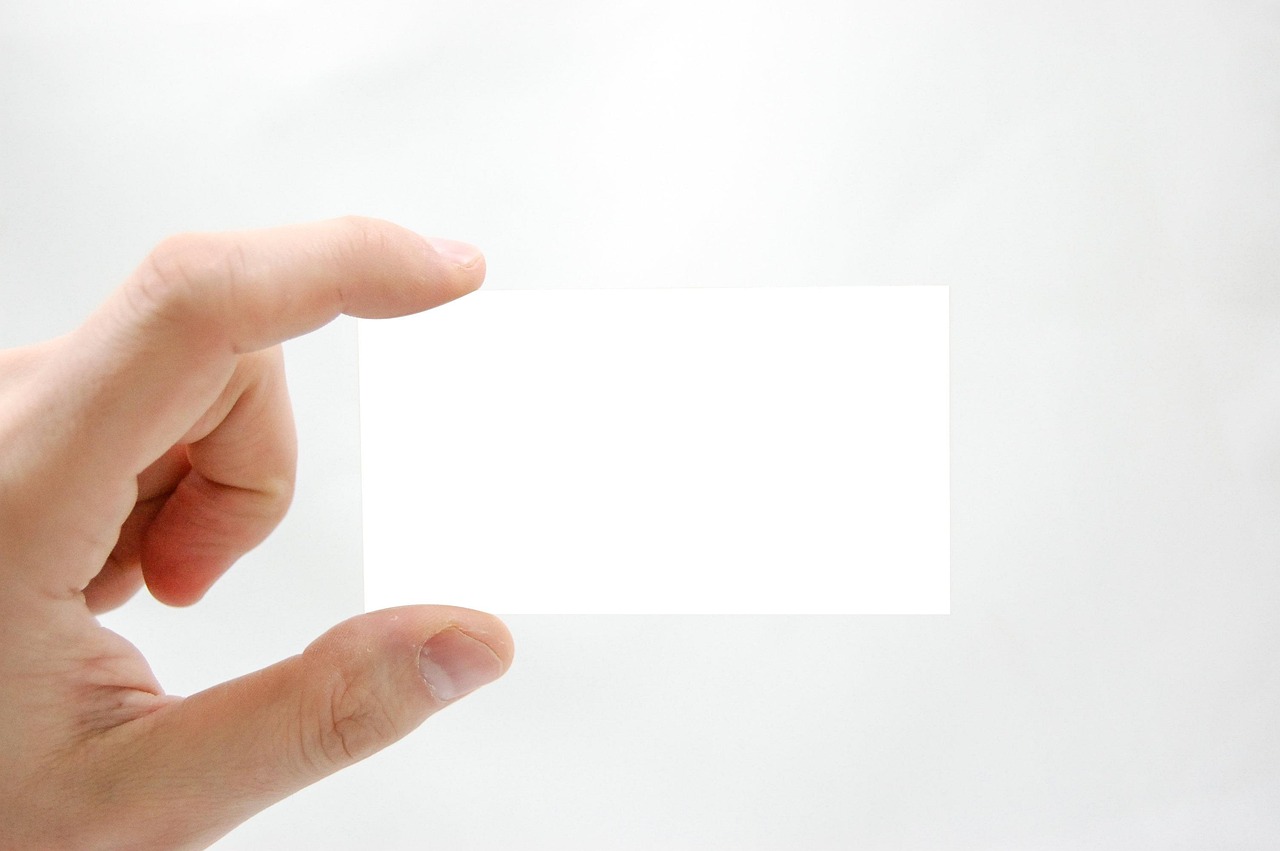Business card, business, hand — Quick Cash Fix: Exploring $50 Loan Options in Canada